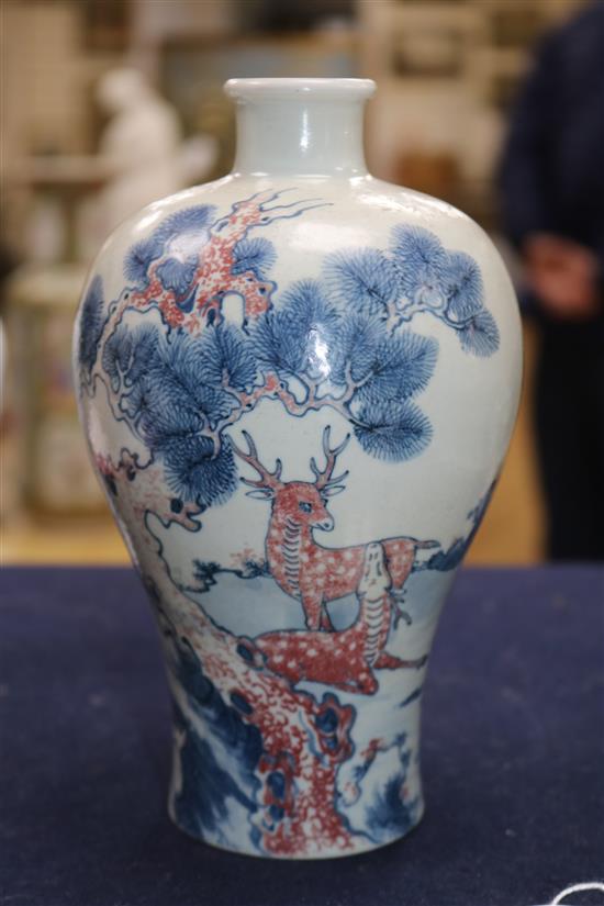 An underglazed red 19th century Chinese vase and two others (3) Largest H.19cm